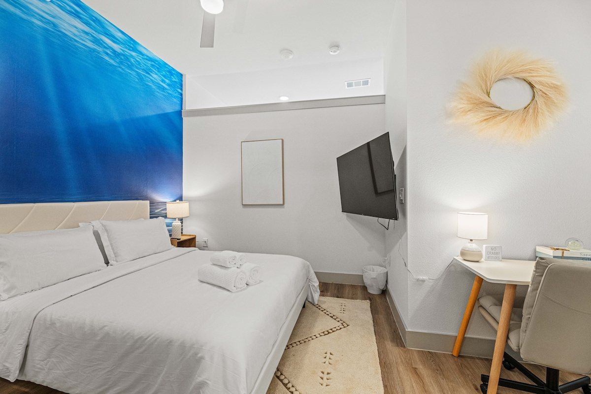 Bed with ocean-blue accent wall